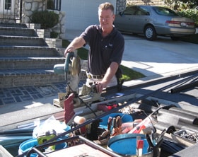 ALL-WAYS SCREENS technician preparing screen materials at a residential job