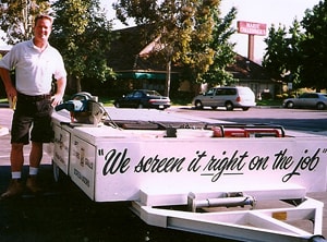 Fred Stickles standing beside the ALL-WAYS SCREENS mobile service trailer