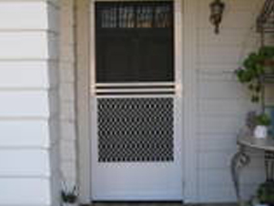 Residential front entry with a white screen door