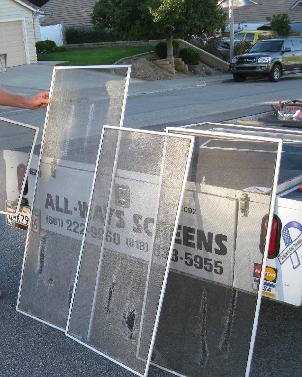 Finished window screens displayed beside the ALL-WAYS SCREENS truck